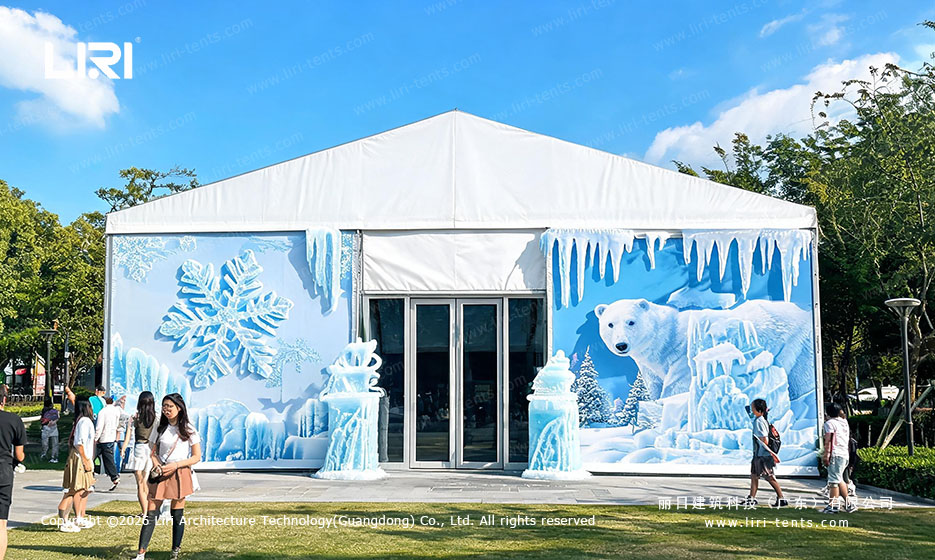Temporary ice exhibition tent operating in a summer setting
